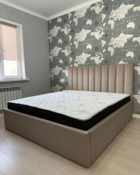 Cama color gris tapizada  colchon. nueva